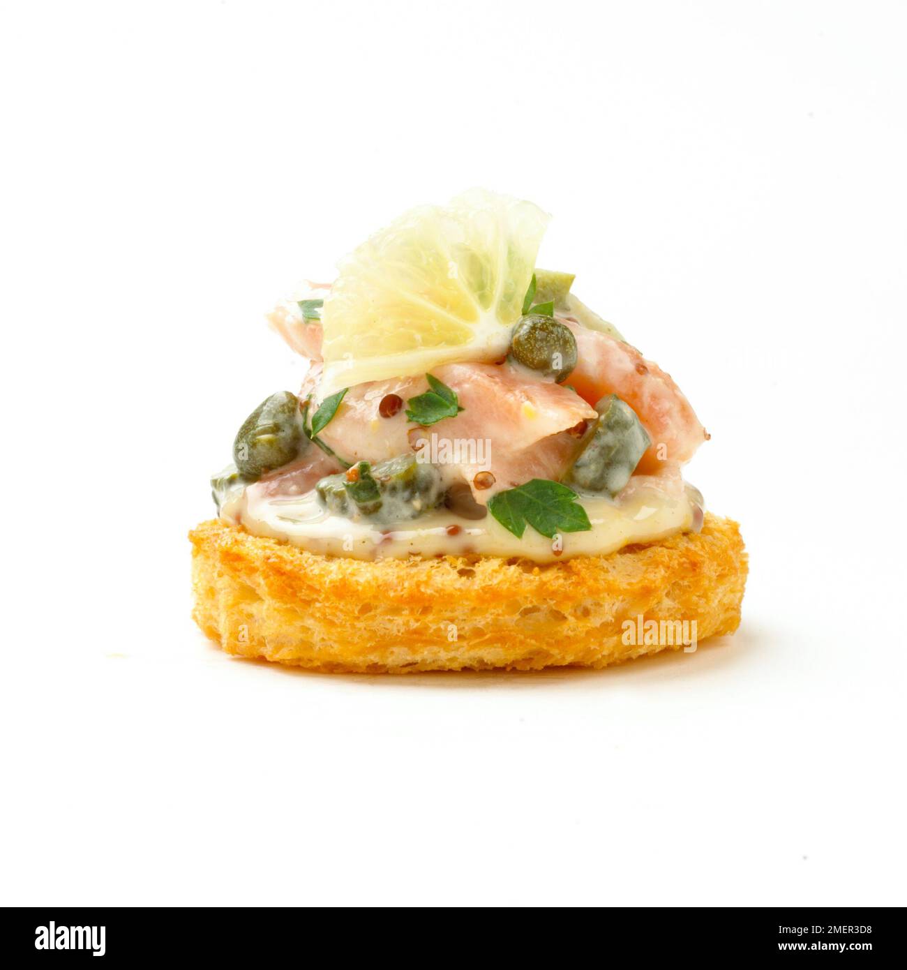 Salmon tartare croute with capers and lemon, canape Stock Photo - Alamy