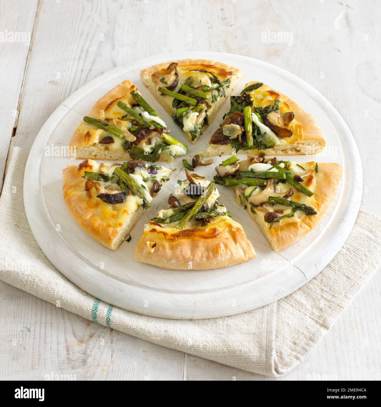 Griddled asparagus, mushroom and garlic pizza Stock Photo