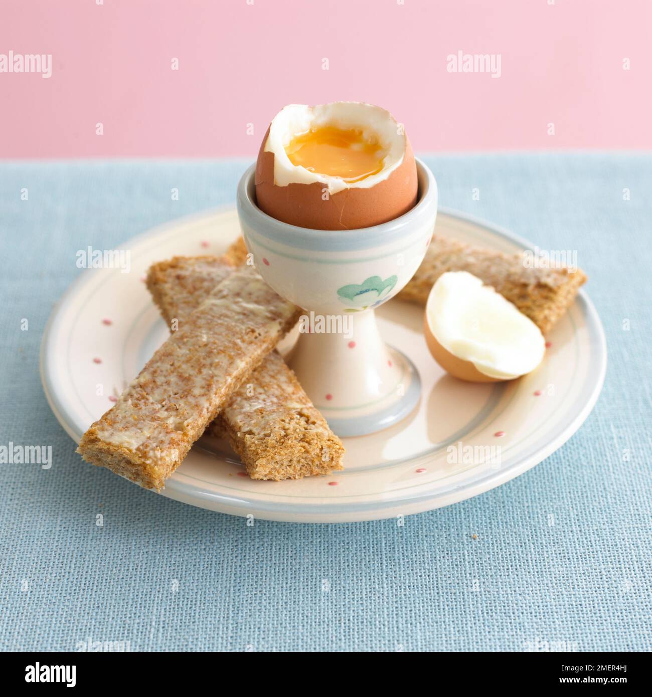 Boiled egg and sliced buttered toast Stock Photo Alamy