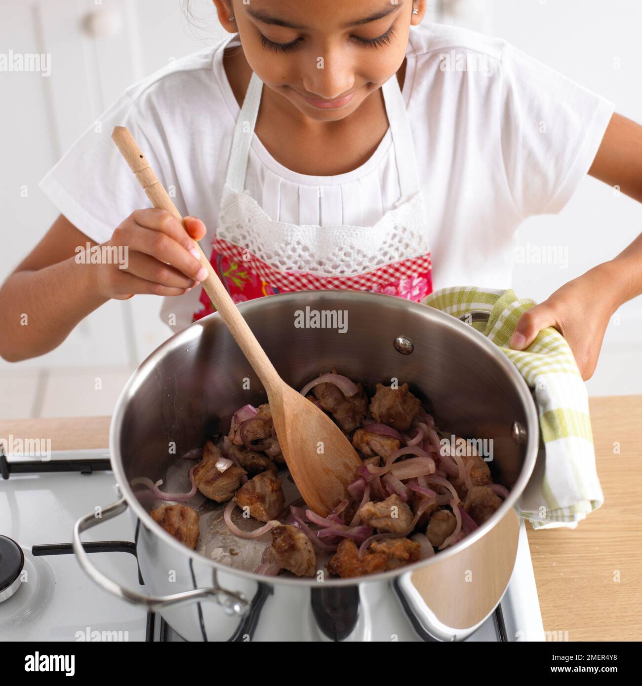 Child cooking 8 9 years pot hi-res stock photography and images - Alamy