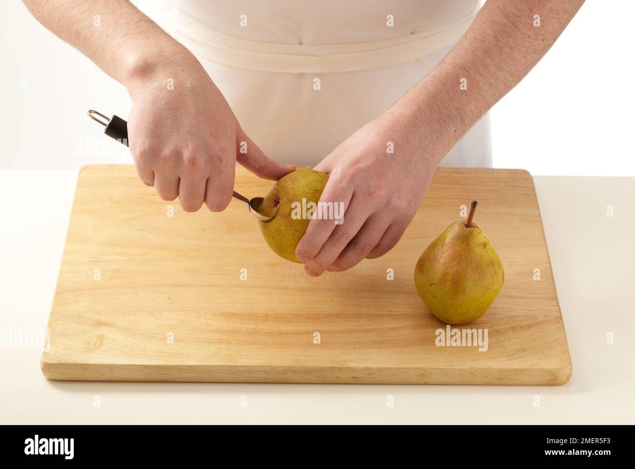 Man hand holding pear hi-res stock photography and images - Alamy