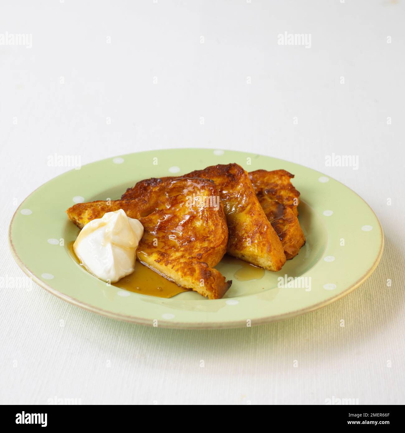 Brioche French toast with yoghurt and maple syrup Stock Photo Alamy
