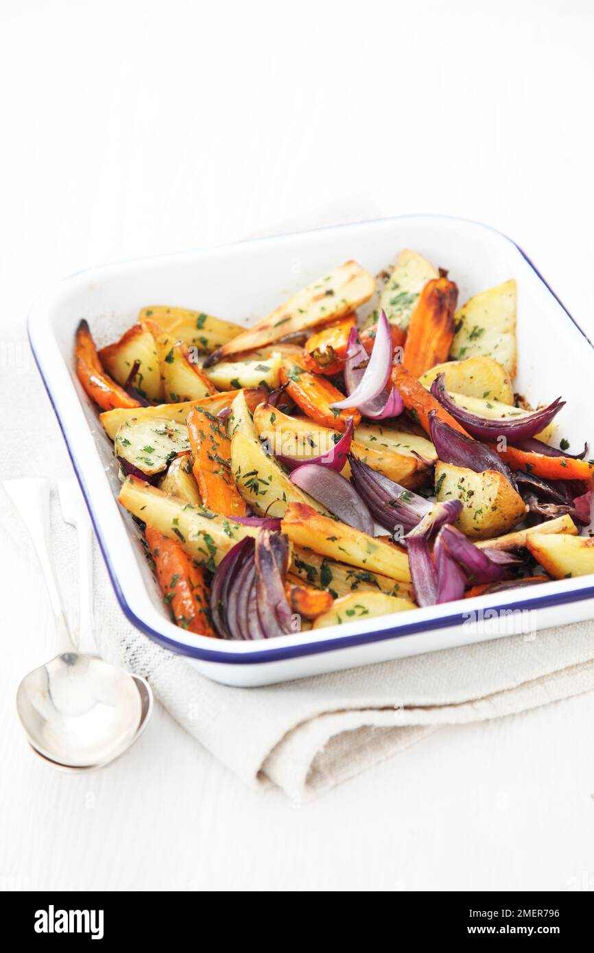 Herby roasted root vegetables Stock Photo