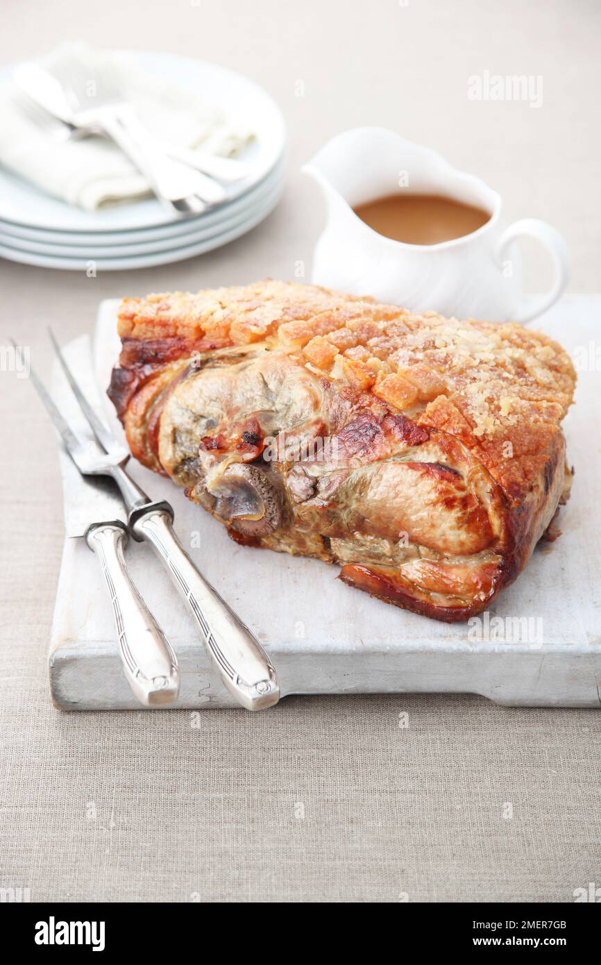 Slow roasted shoulder of pork and gravy Stock Photo Alamy