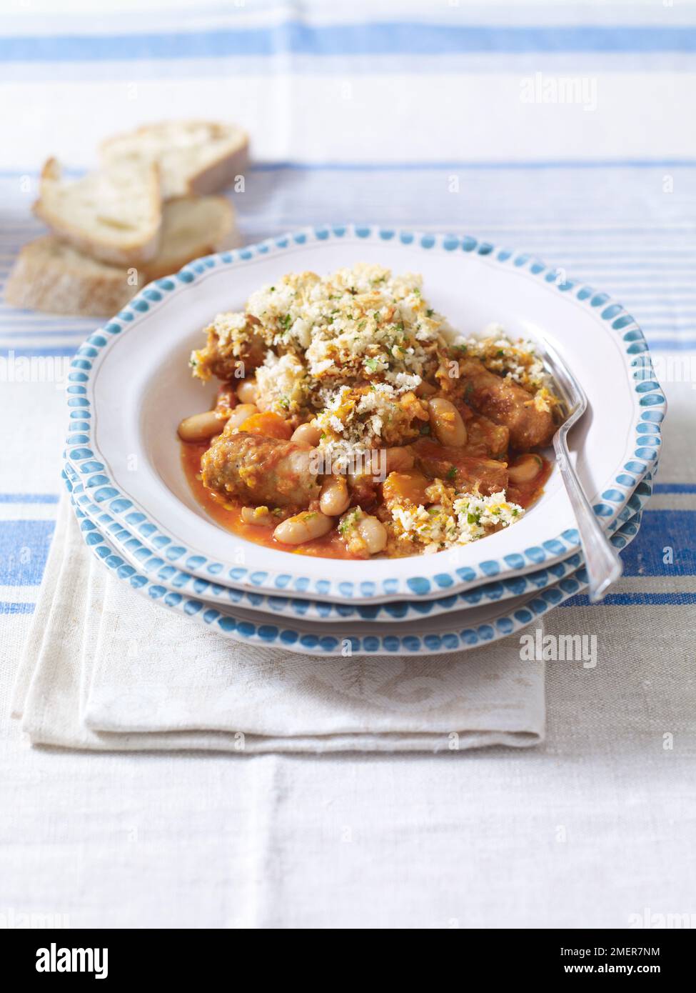 Sausage and bean cassoulet and breadcrumb top Stock Photo