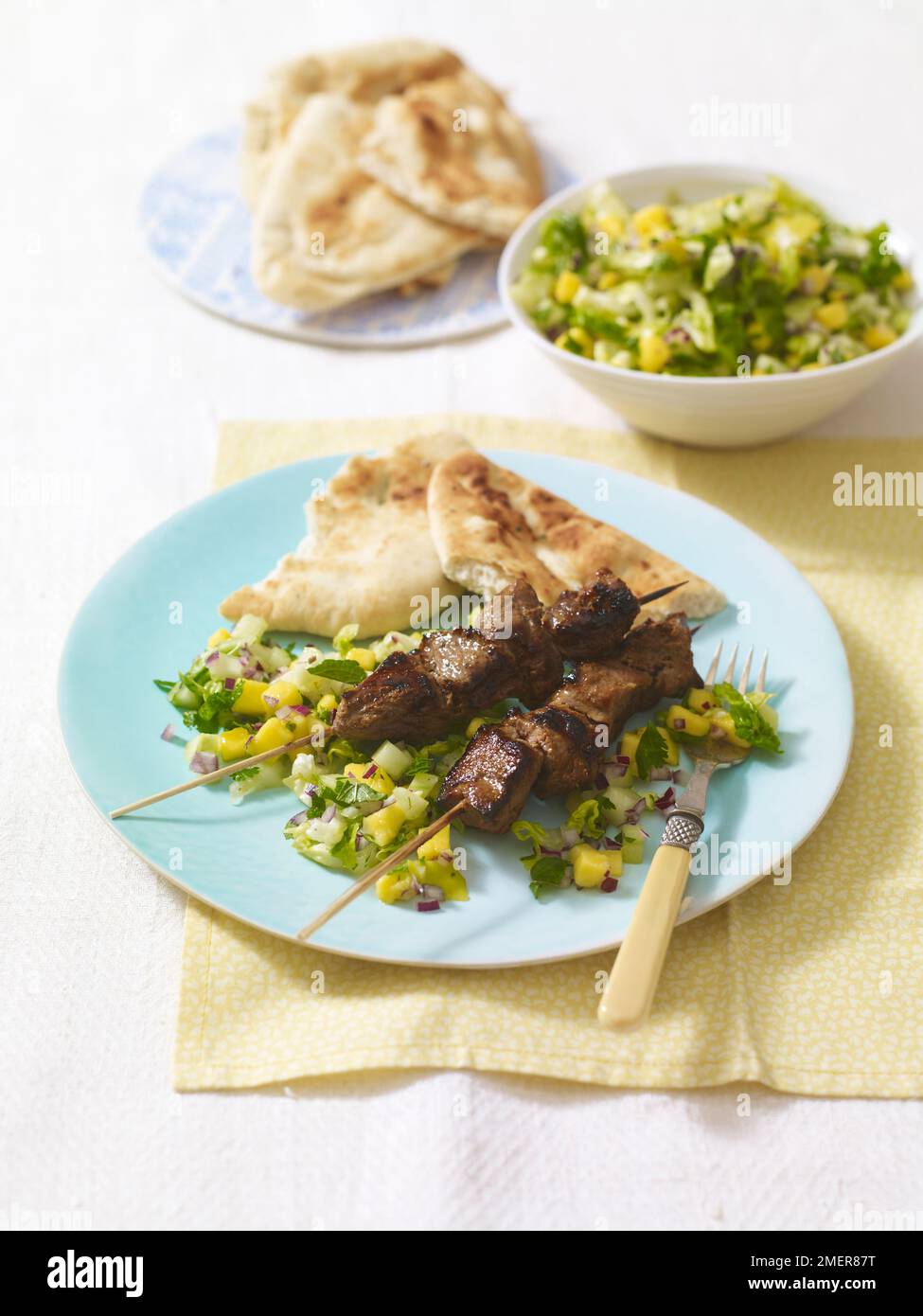 Tandoori lamb kebabs, salad and naan bread Stock Photo Alamy