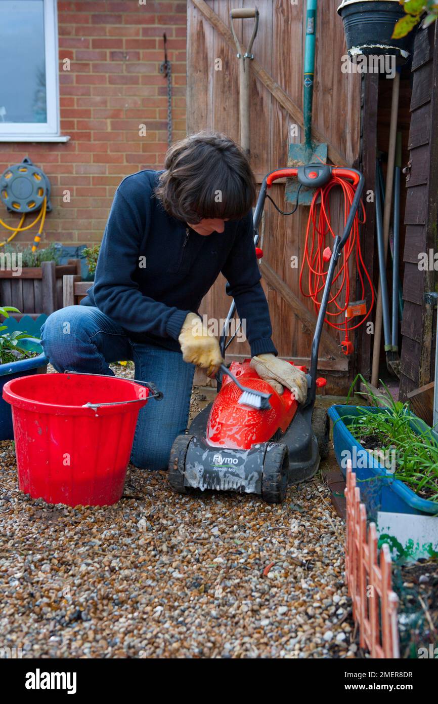 Cleaning a mower Stock Photo Alamy