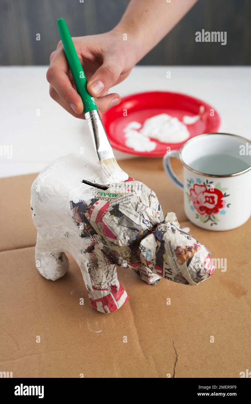 Making a papiermache polar bear piggy bank using old milk bottle