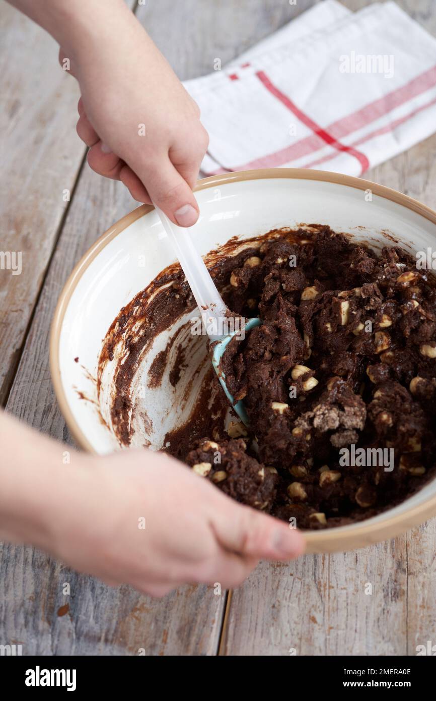 Mixing ingredients together, making brownies Stock Photo Alamy