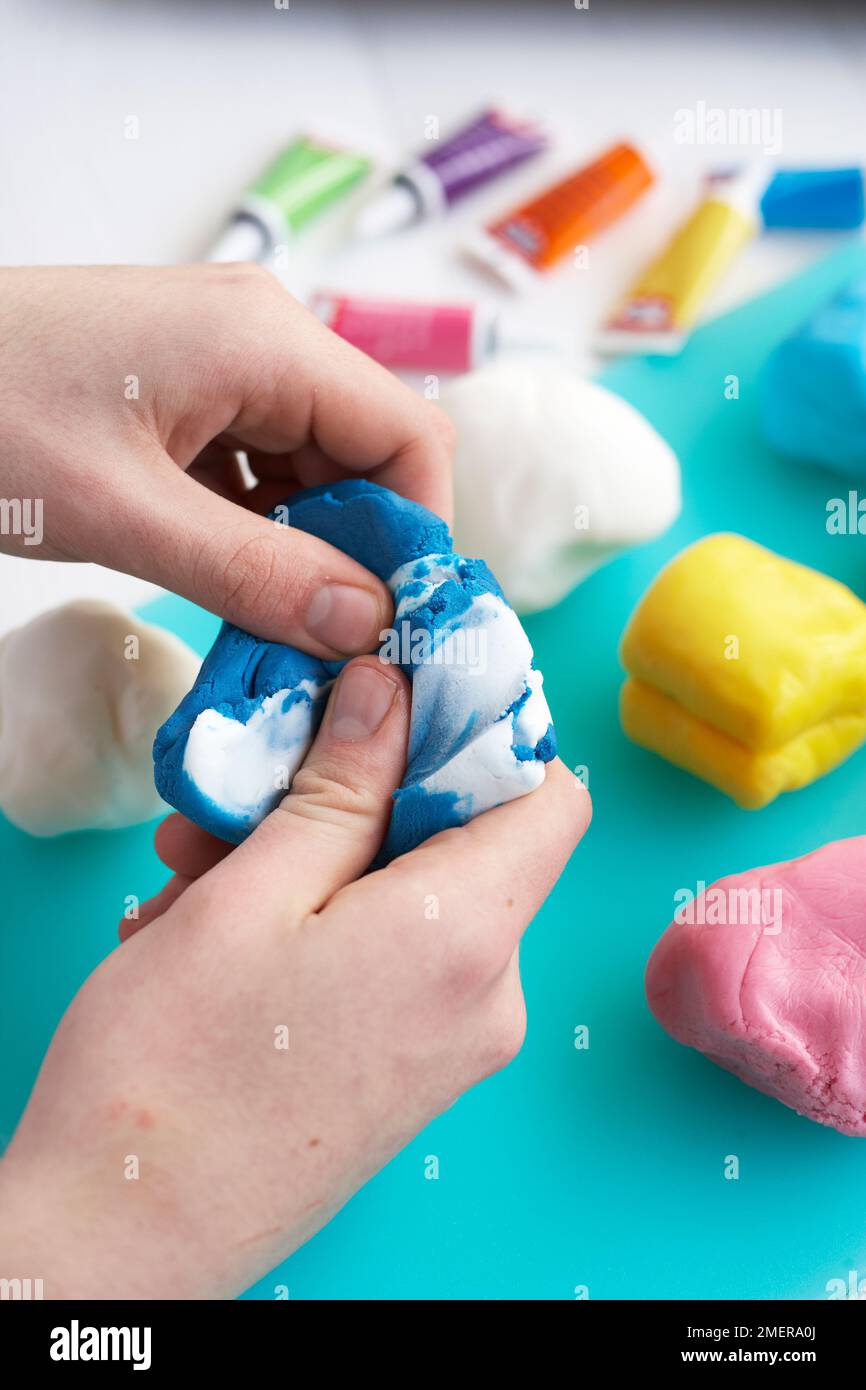 Dividing ready-to-roll icing into portions Stock Photo