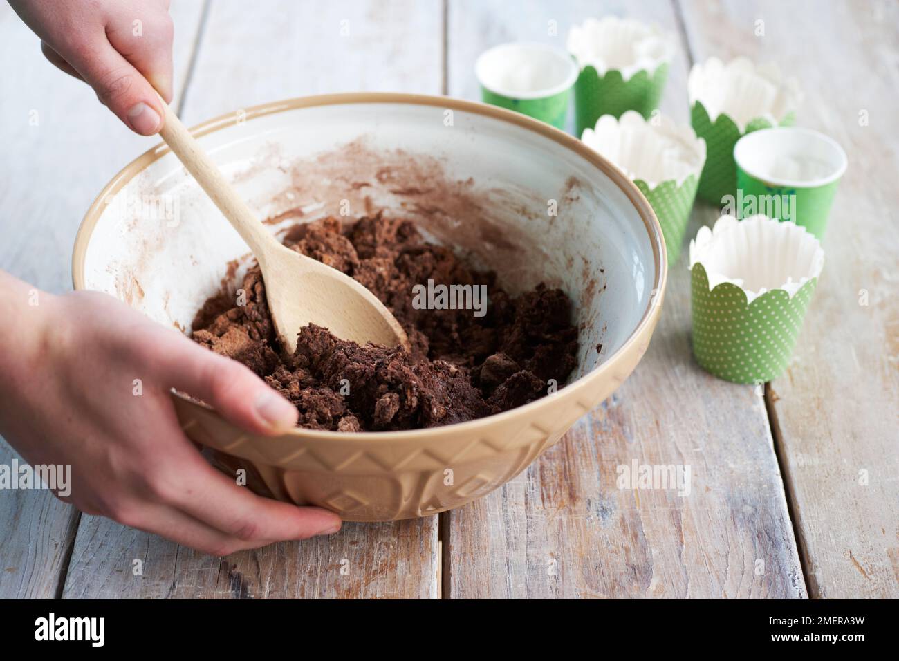 Mixing together chocolate cake ingredients, making flowerpot cakes