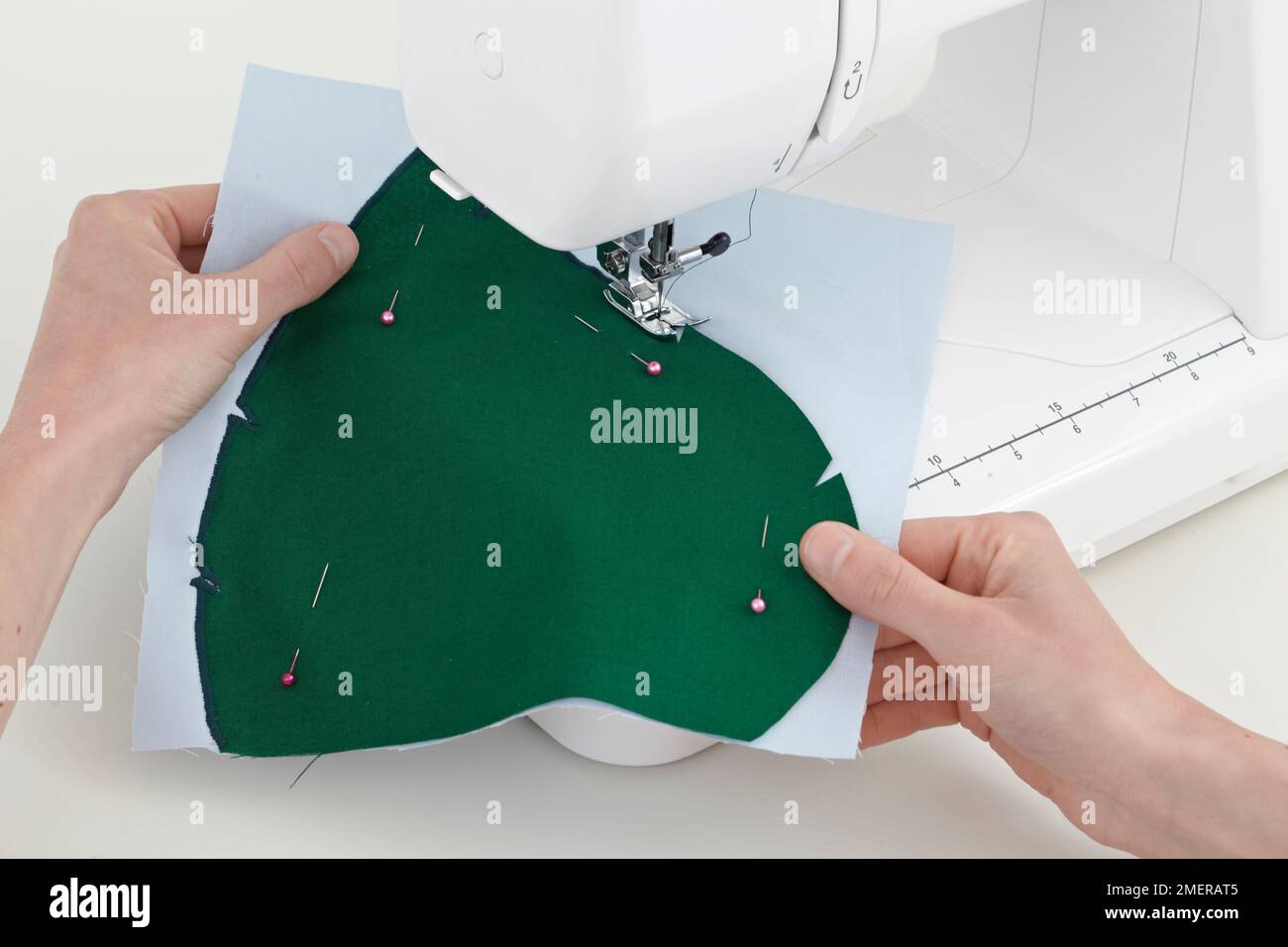 Fabric picture book, pin and sew fabric in place Stock Photo Alamy