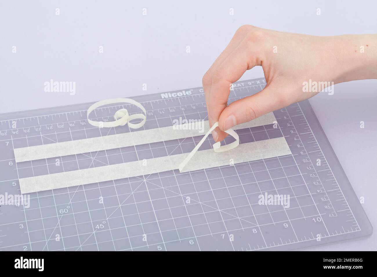 Use masking tape to create a stencil on measuring board Stock Photo Alamy
