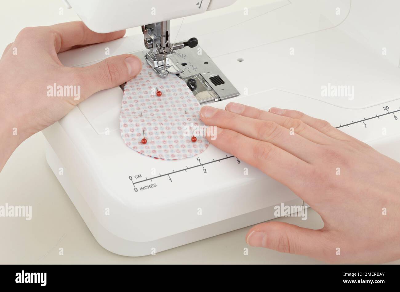 Sewing two ear patterns together, making soft toy Stock Photo Alamy