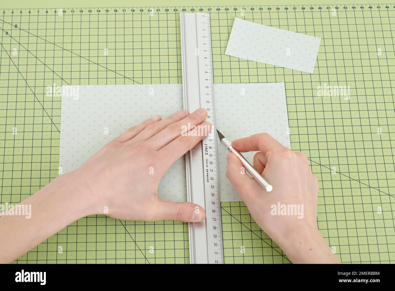 Cutting paper with craft knife Stock Photo Alamy
