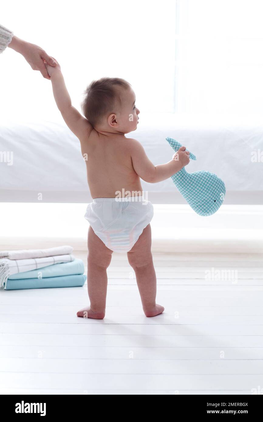 Toddler standing full length diaper boy hi-res stock photography and images  - Alamy