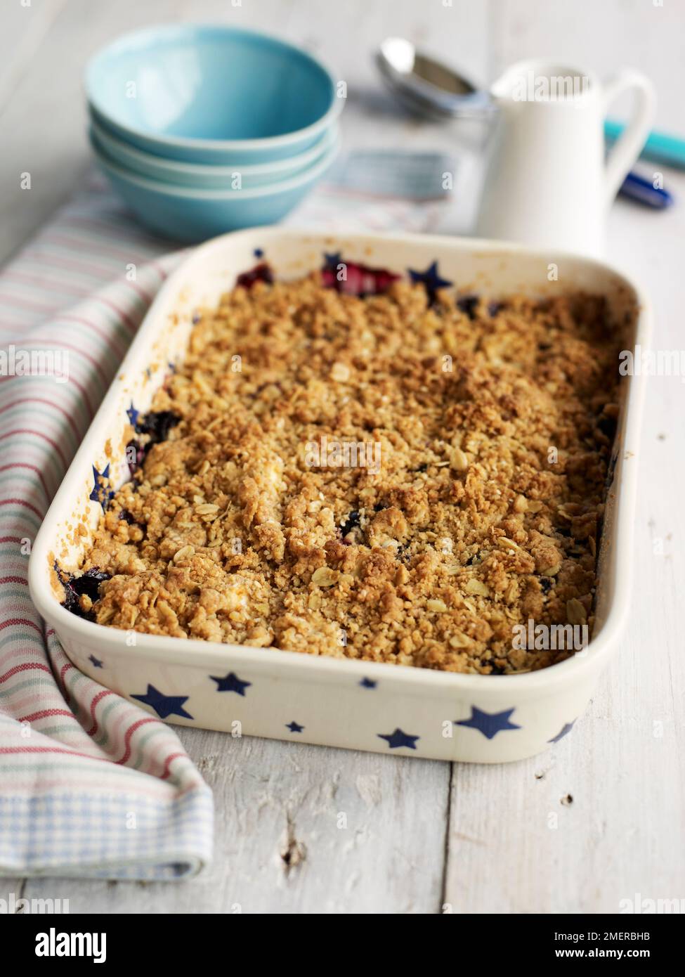 Apple and grape crumble bake in pie dish Stock Photo