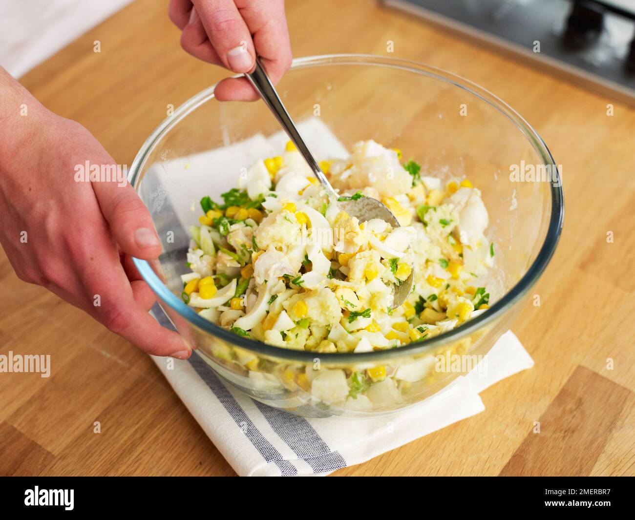 Fish cakes, mixing ingredients in large glass bowl Stock Photo Alamy