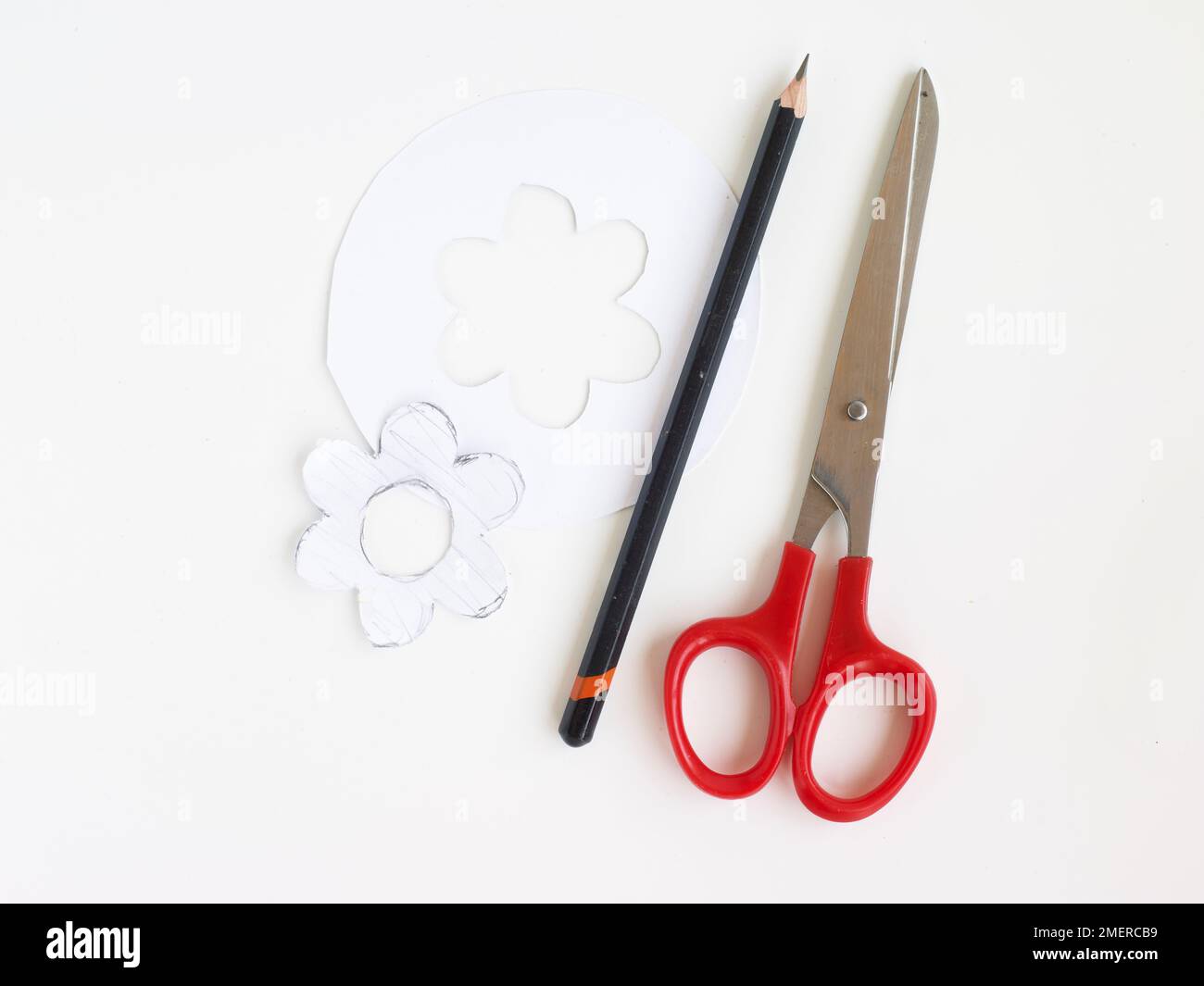 Making flower shaped stencil Stock Photo