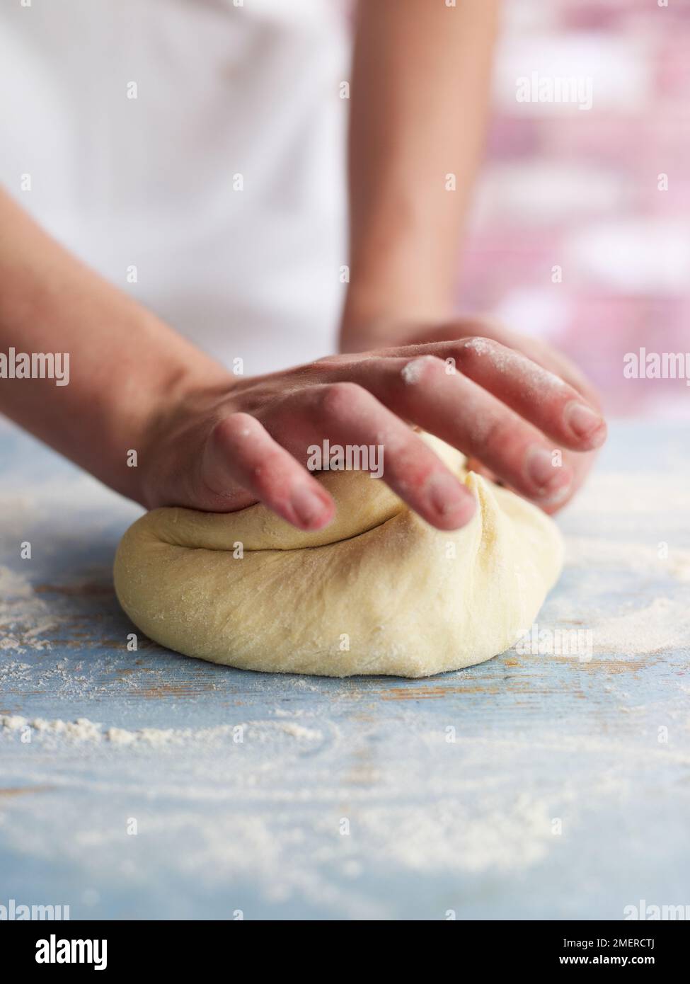 Kneading dough on a floured surface Stock Photo Alamy