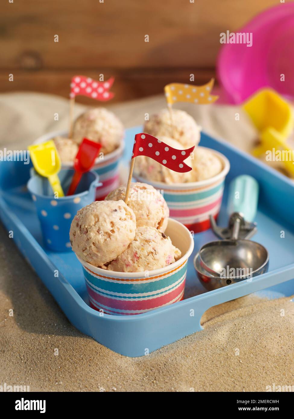 Scoops of frozen yogurt in tubs Stock Photo