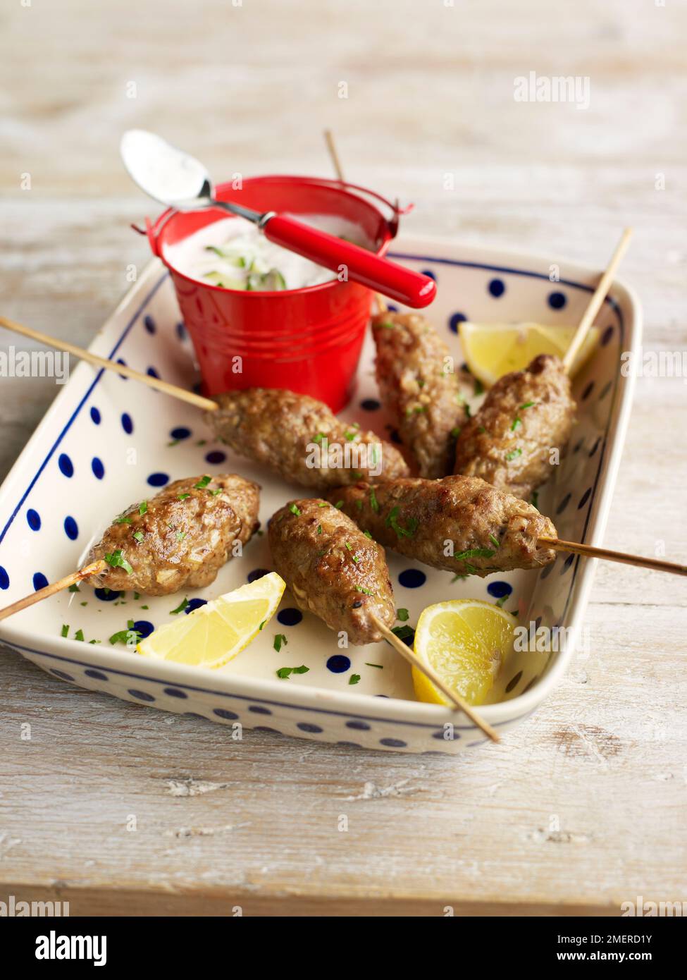 Lamb kebab with mint yoghurt Stock Photo Alamy