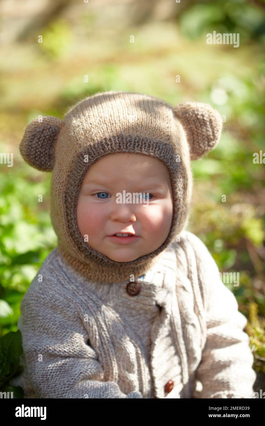 Baby boy wearing a bearaclava, balaclava with ears, 17 months Stock Photo
