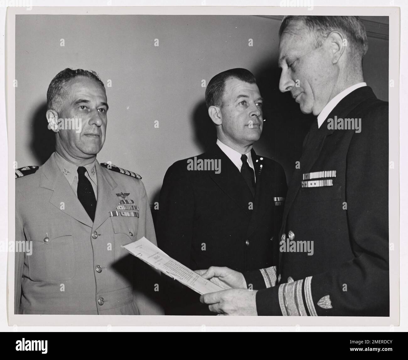 Captain Frank A. Leamy, USCG (Left) receiving Navy Commendation Ribbon from VADM Merlin O'Neill, Commandant of USCG. 5 May 1948. Stock Photo