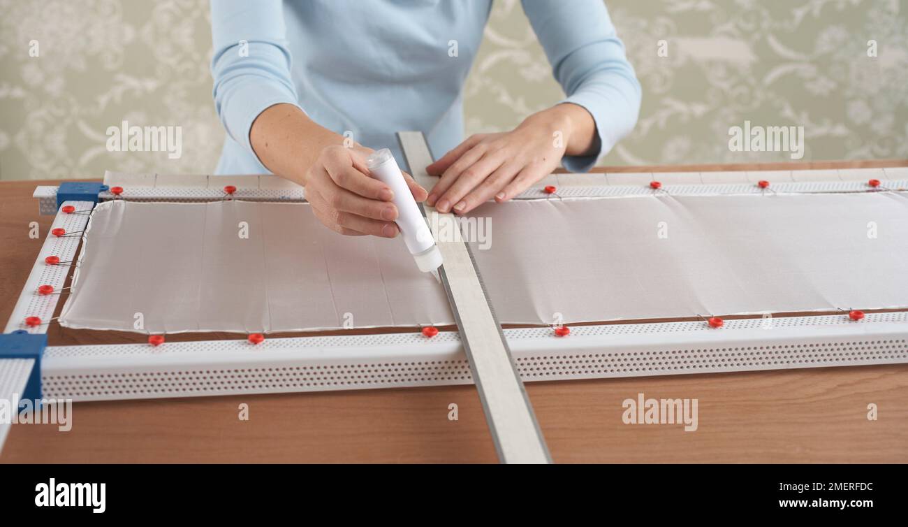 Silk painting, With a ruler, use gutta to draw a line at each marked ...