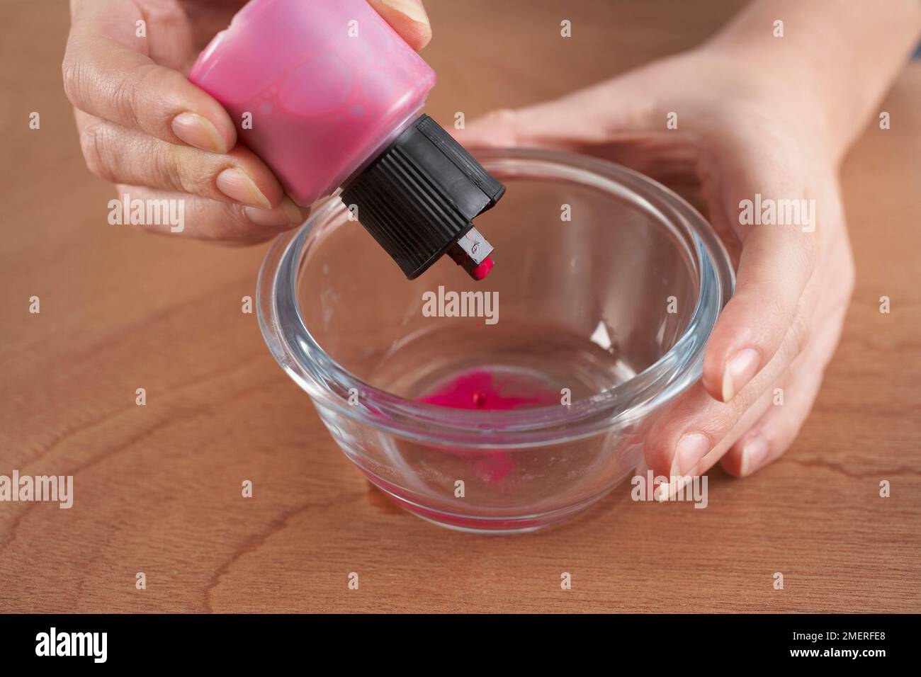 Adding silk colour to a bowl Stock Photo