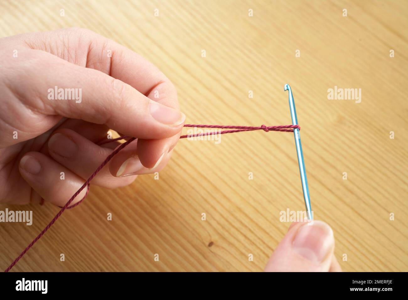 Making crochet necklace, Making a slip knot Stock Photo