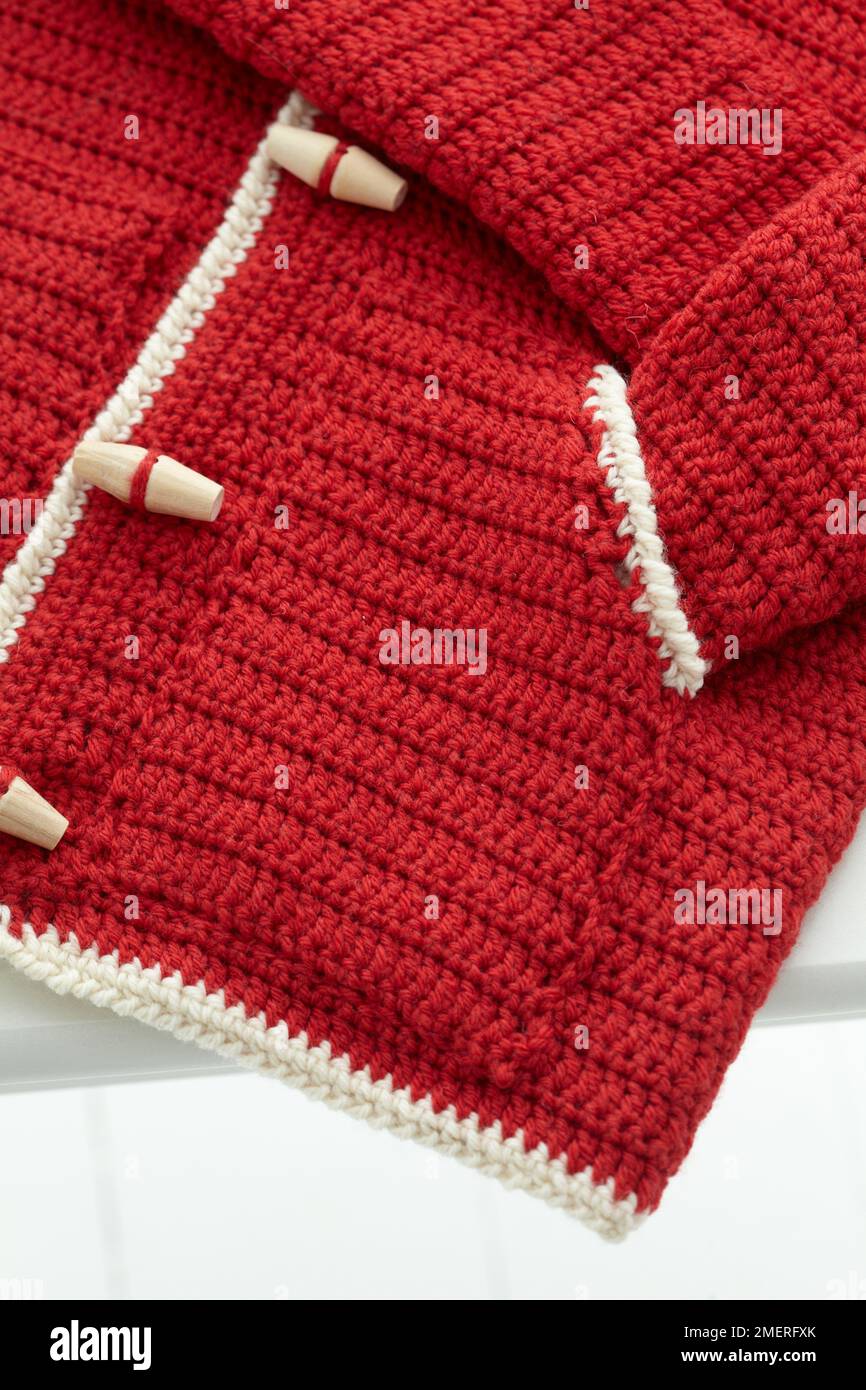 Crocheted child hoodie Stock Photo