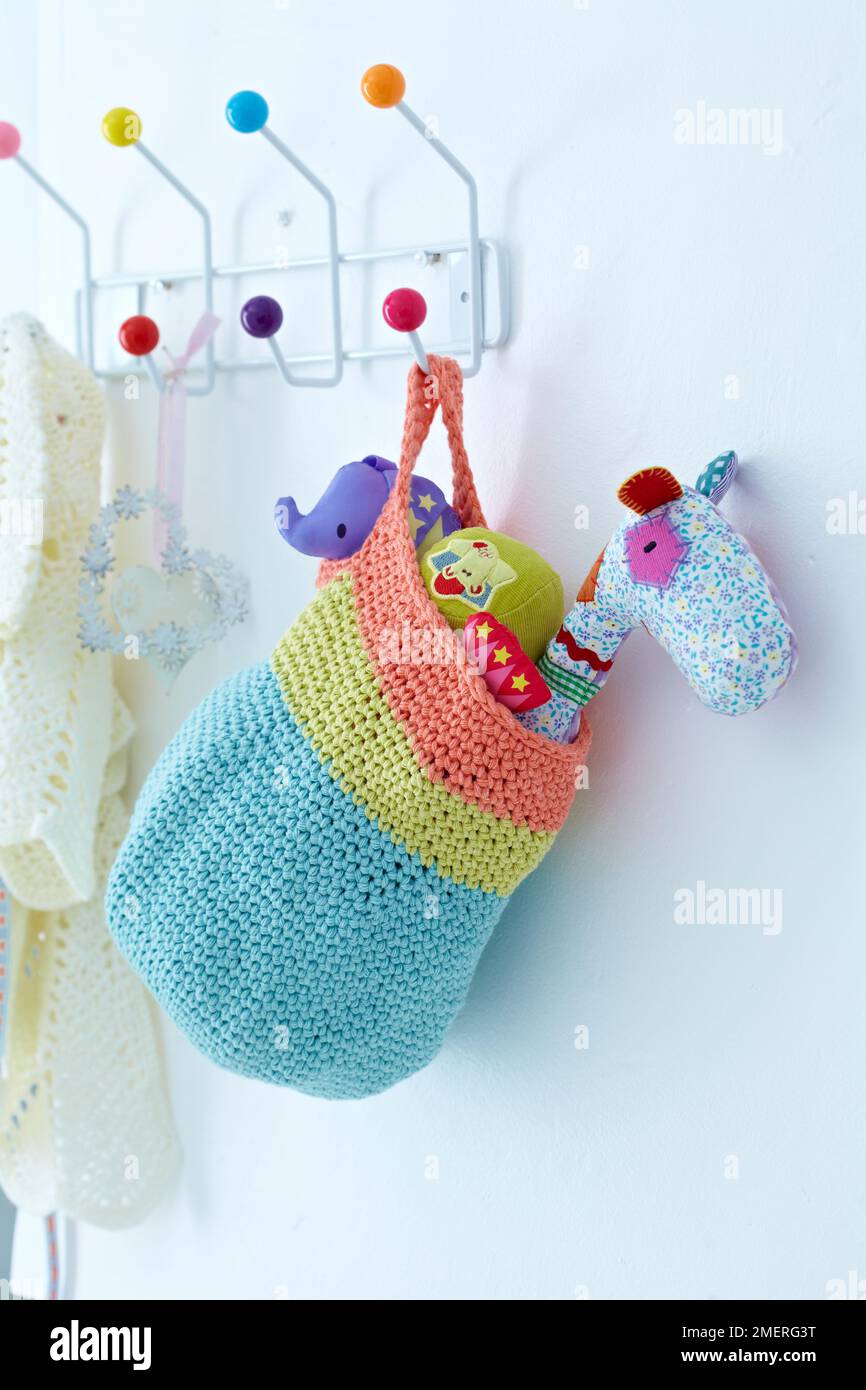 Crocheted hanging toy basket Stock Photo Alamy