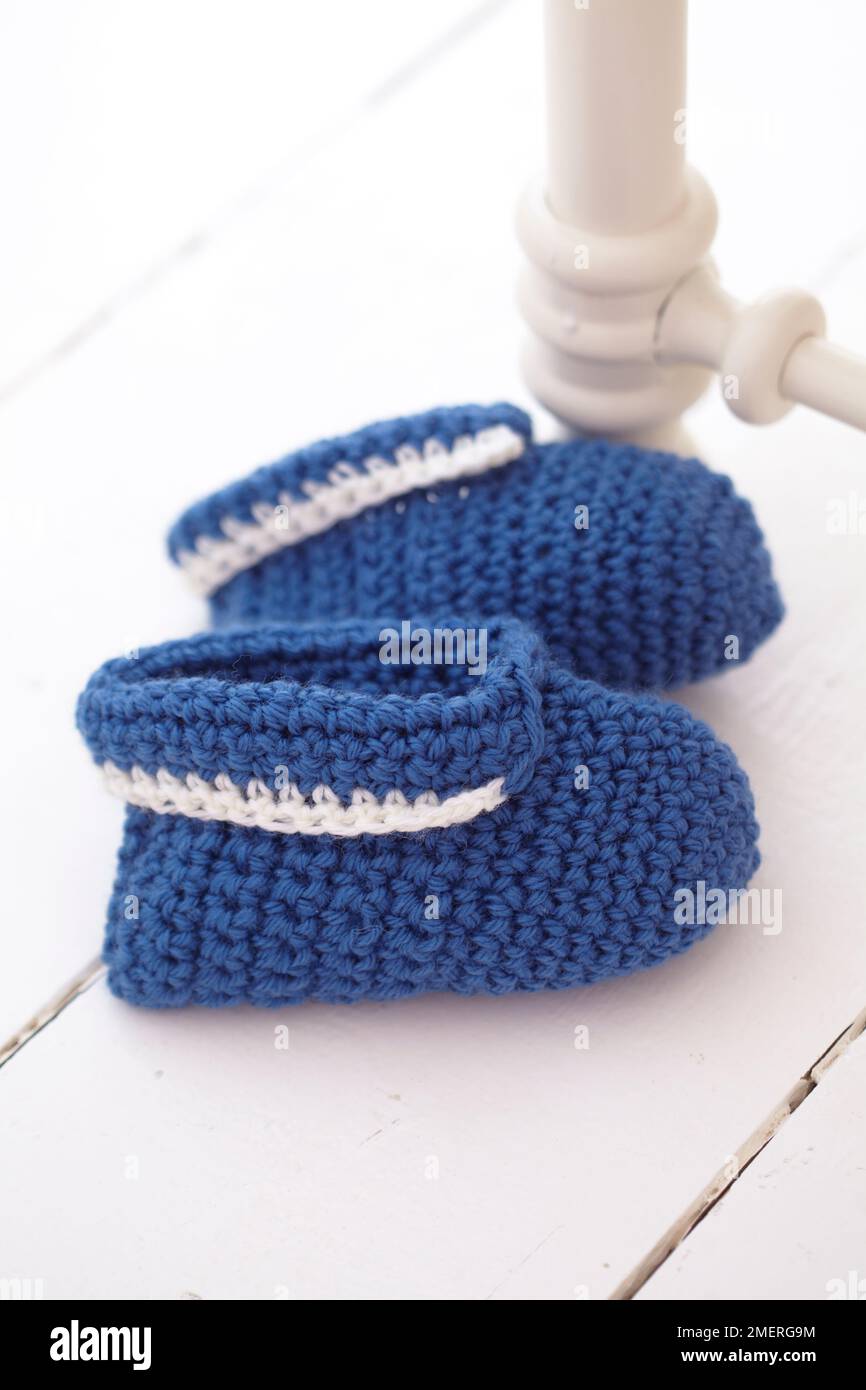 Crocheted children's slippers Stock Photo
