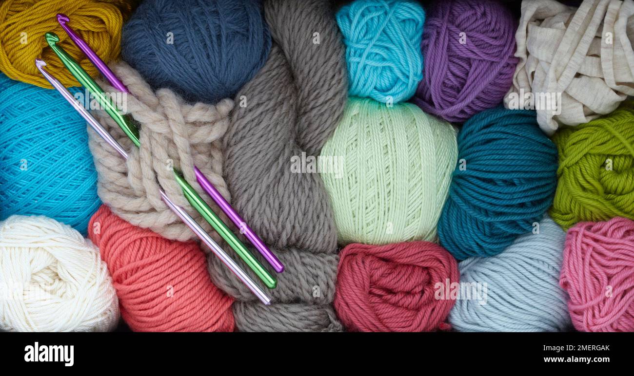 Balls of wool and crochet needles Stock Photo