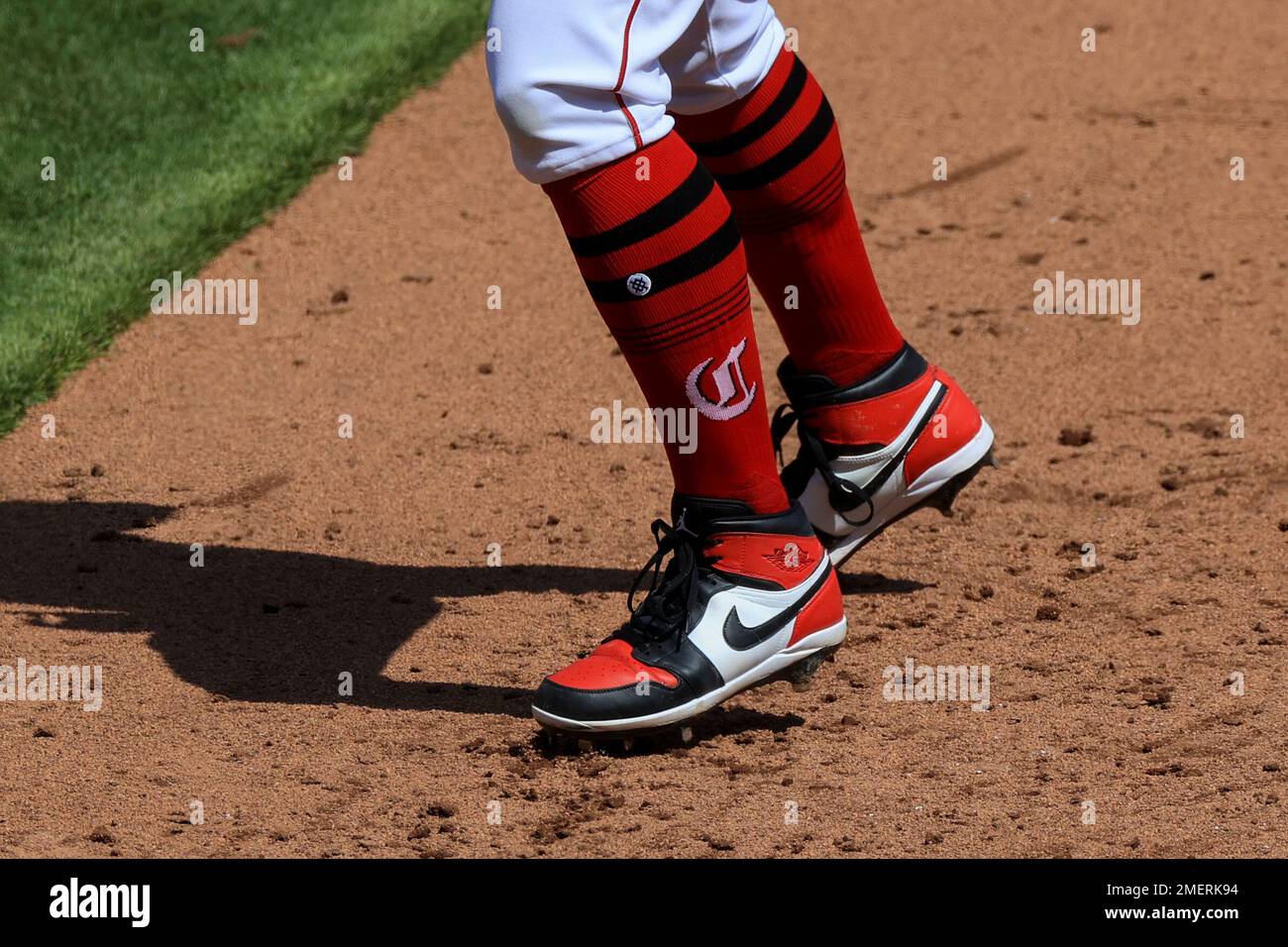 The socks and cleats worn by St. Louis Cardinals' Miles Mikolas are seen as  he throws during a baseball game against the Cincinnati Reds in Cincinnati,  Thursday, May 25, 2023. (AP Photo/Aaron