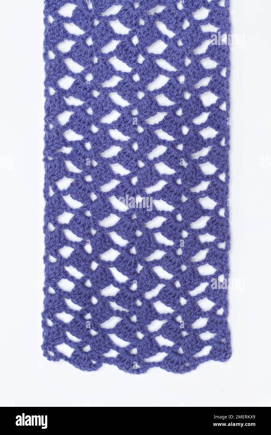 Lacy purple crochet scarf (fans stitch) Stock Photo