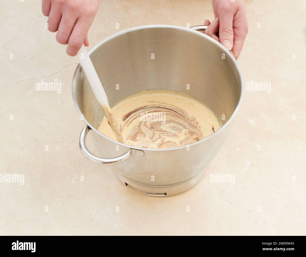 Adding red food colouring to sponge cake mixture Stock Photo Alamy