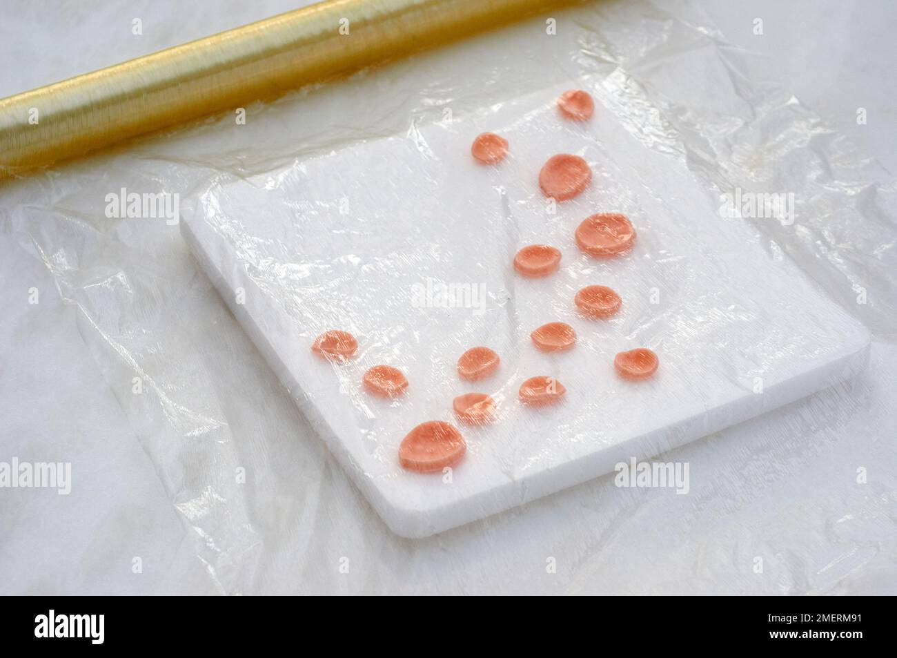 Fondant icing shapes drying under clingfilm Stock Photo Alamy
