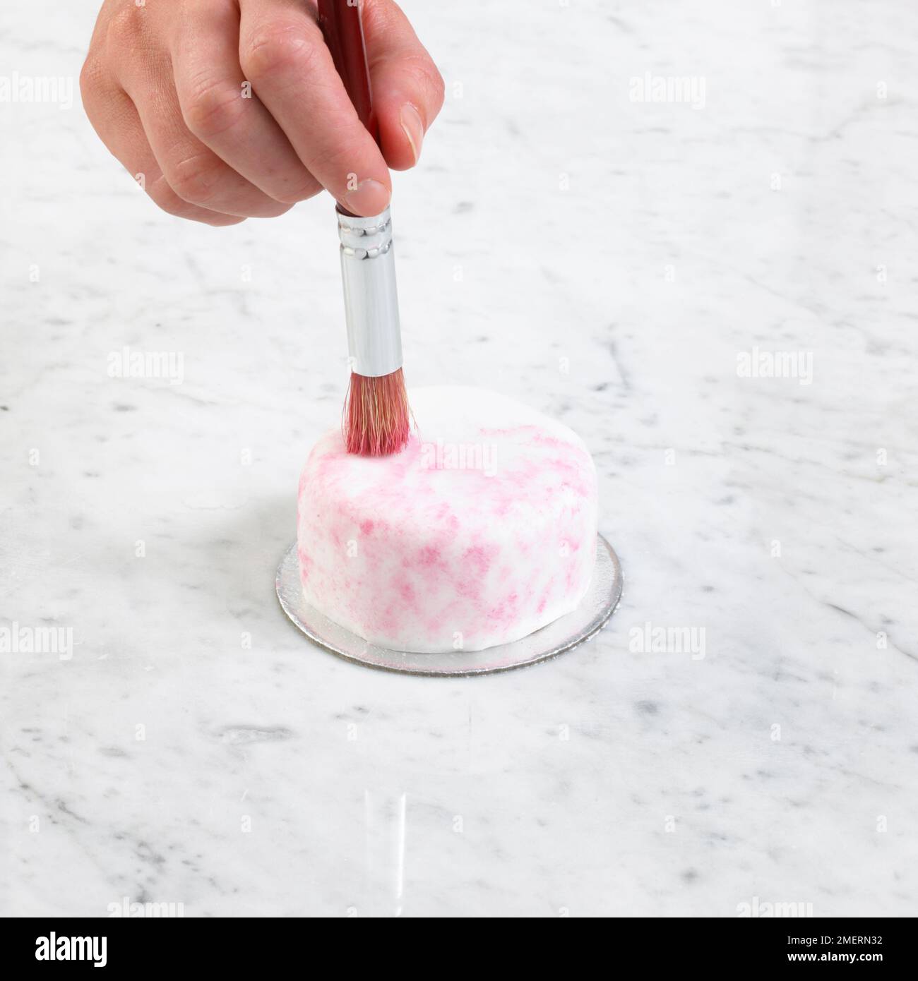 Cake covered with smooth fondant icing decorated by dabbing food