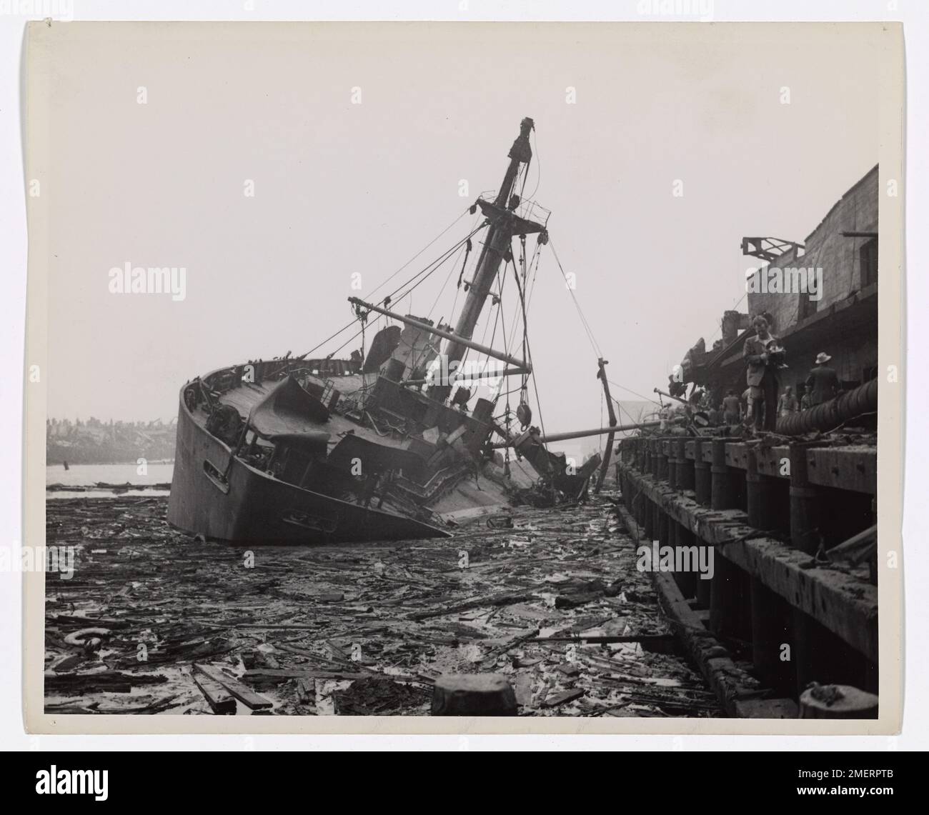 SS Wilson B. Keene, Texas City Fire. This image depicts a ship listing into debris-filled water. Stock Photo