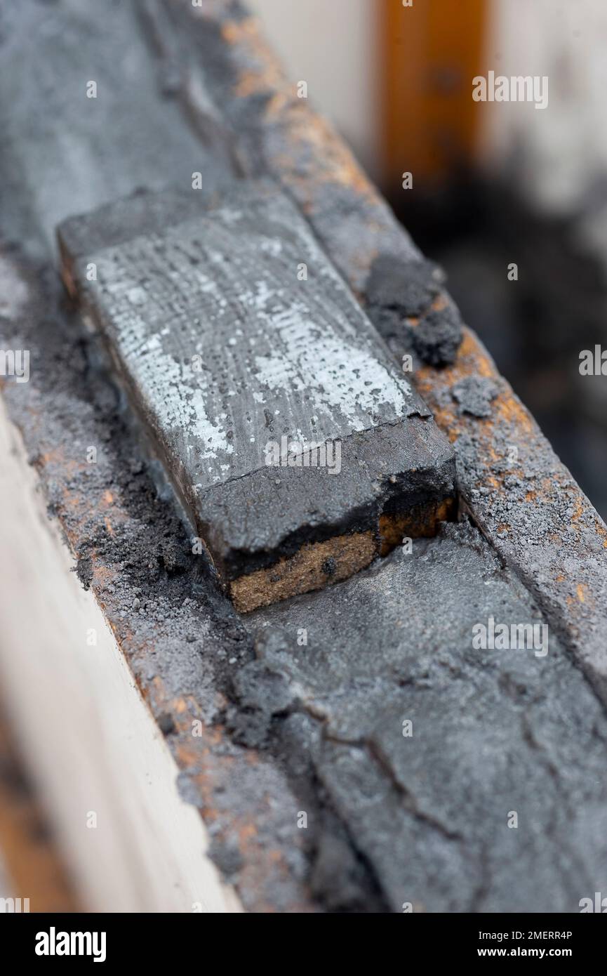 Making concrete planter, using a batten spacer Stock Photo Alamy