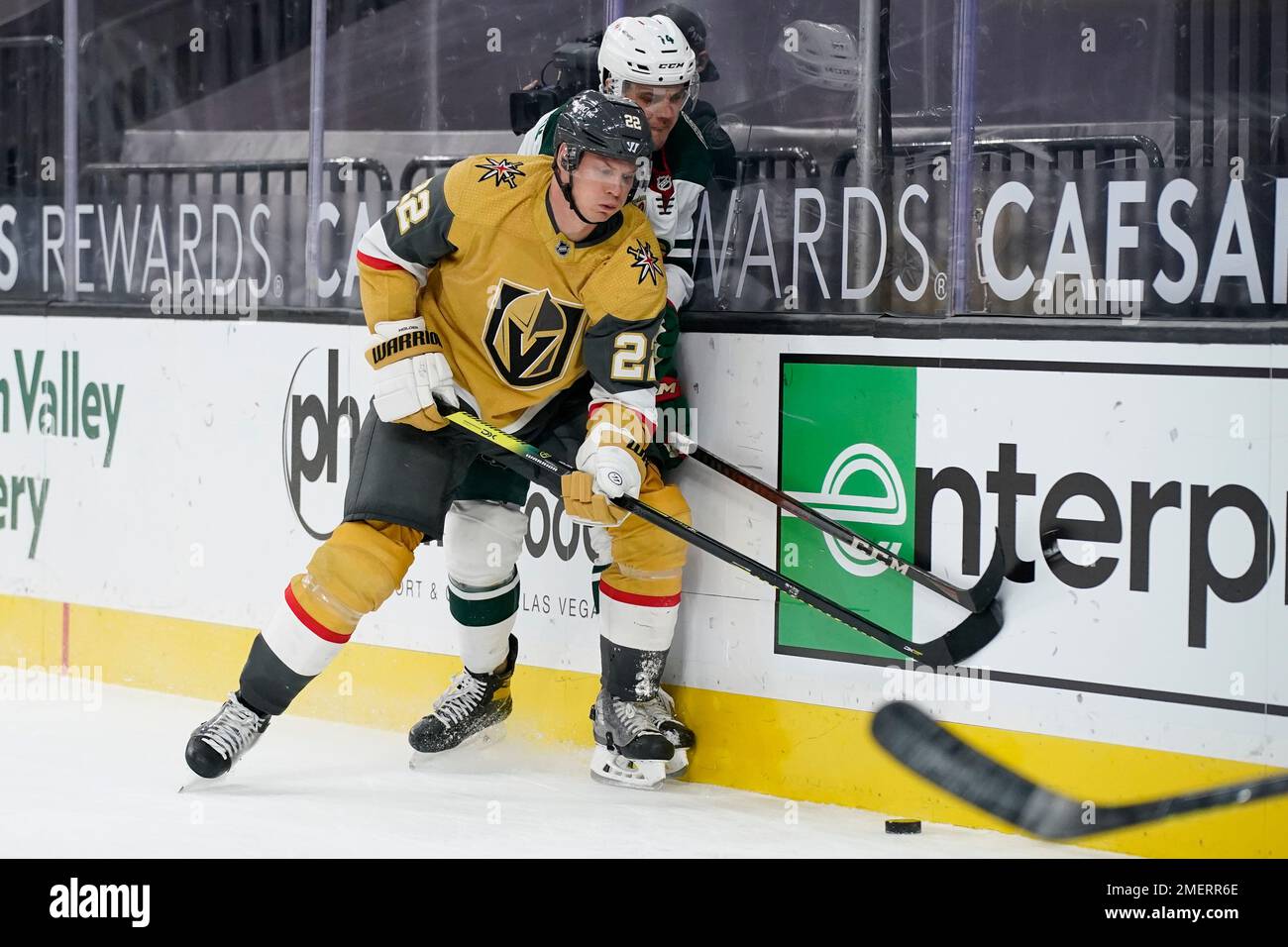 Vegas Golden Knights' Nick Cousins, left, gets past Calgary Flames
