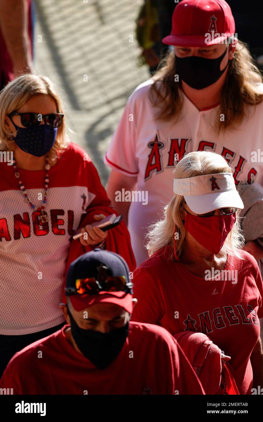 Los Angeles Angels fans wear masks while waiting in line to enter Angel  Stadium before a baseball game against the Chicago White Sox Saturday,  April 3, 2021, in Anaheim, Calif. (AP Photo/Ashley