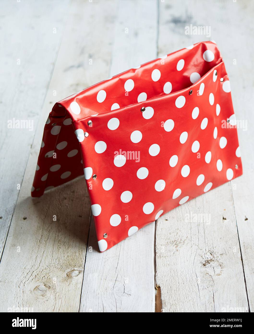 Oilcloth saddle bag planter Stock Photo