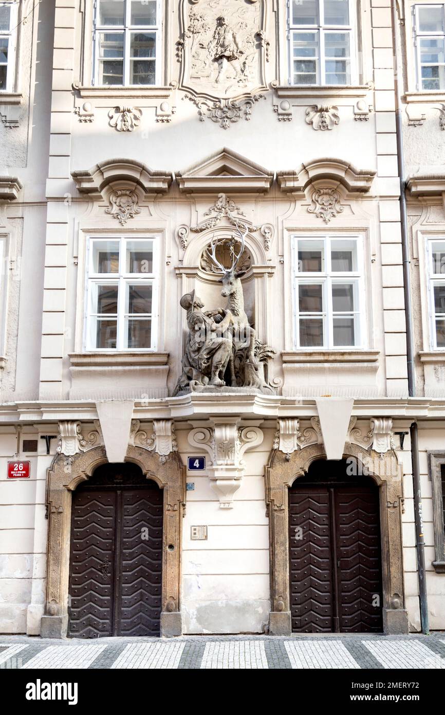 The Golden Stag and Saint Hubert sculpture on a building facade, St Thomas’s Street, Prague, Czech Republic Stock Photo