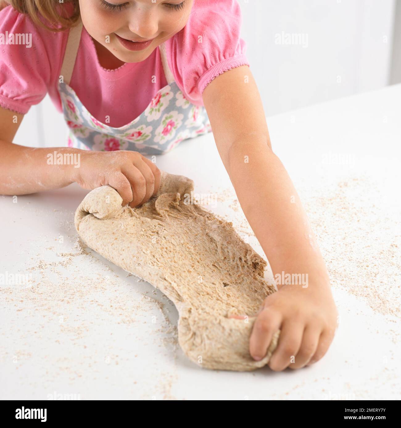 Girl tearing bread dough, 5 years Stock Photo Alamy