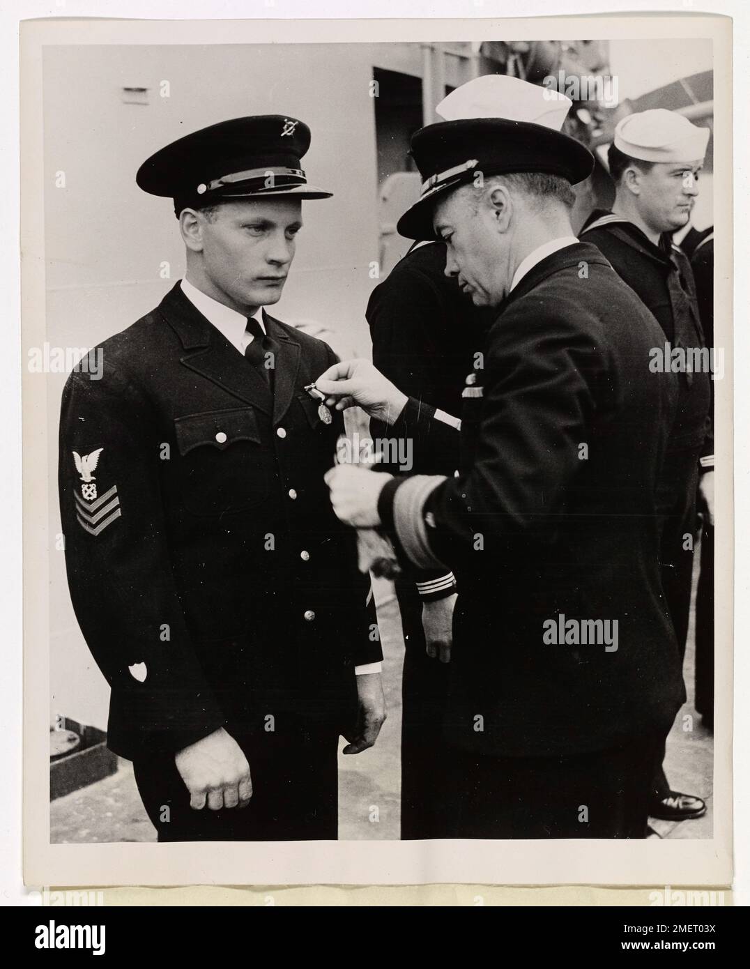 Milwaukee Coast Guardsman awarded Navy, Marine Corps Medal. Coast Guardsman William H. Mueller, Boatswain's Mate, first class, of 2904 Delaware Avenue, Milwaukee, Wisc., has been awarded the Navy and Marine Corps Medal for his outstanding service in making possible the eventual salvage of a flaming and derelict tanker carrying a large cargo of high octane aviation gasoline. The award was conferred by Rear Admiral E.H. Smith in behalf of the commander in Chief, U. S. Atlantic Fleet. Mueller serves aboard a Coast Guard Combat Cutter. Stock Photo