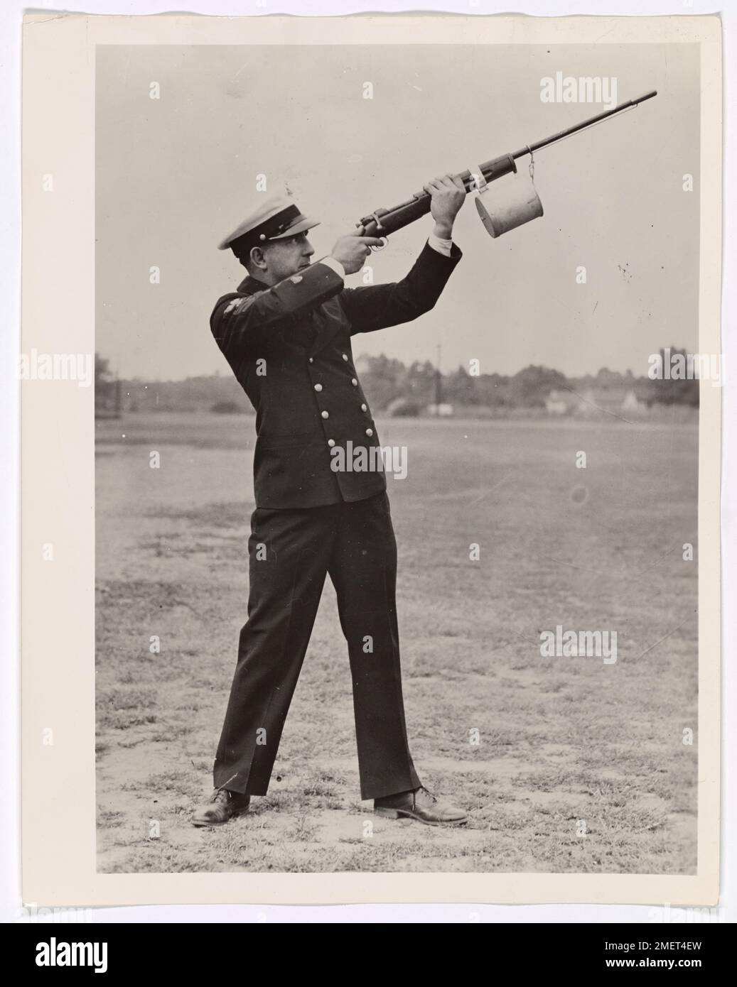 Shoulder Line Throwing Gun. This image depicts a Coast Guardsmen using