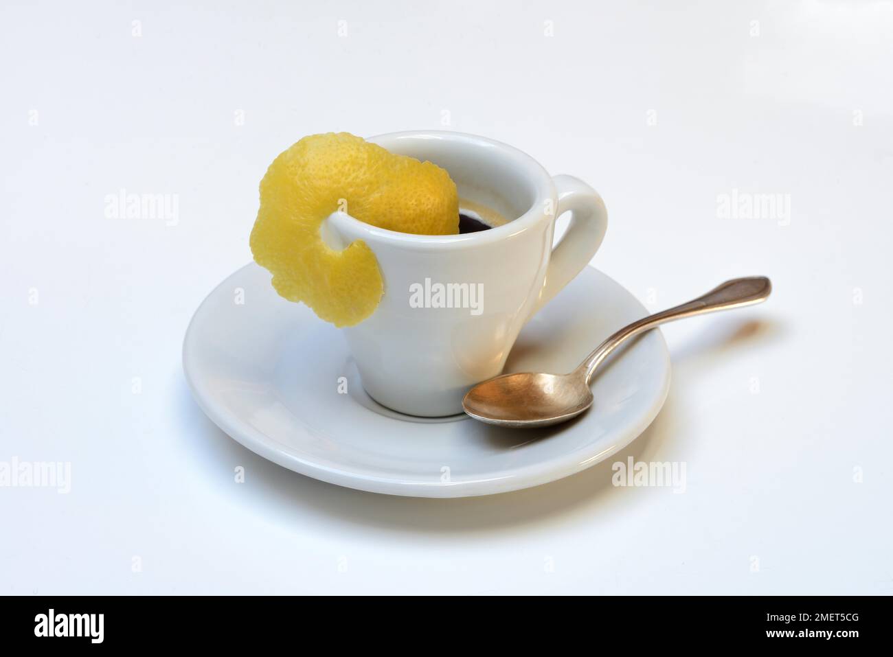 Espresso Romano, cup of espresso with lemon zest, coffee preparation Stock Photo